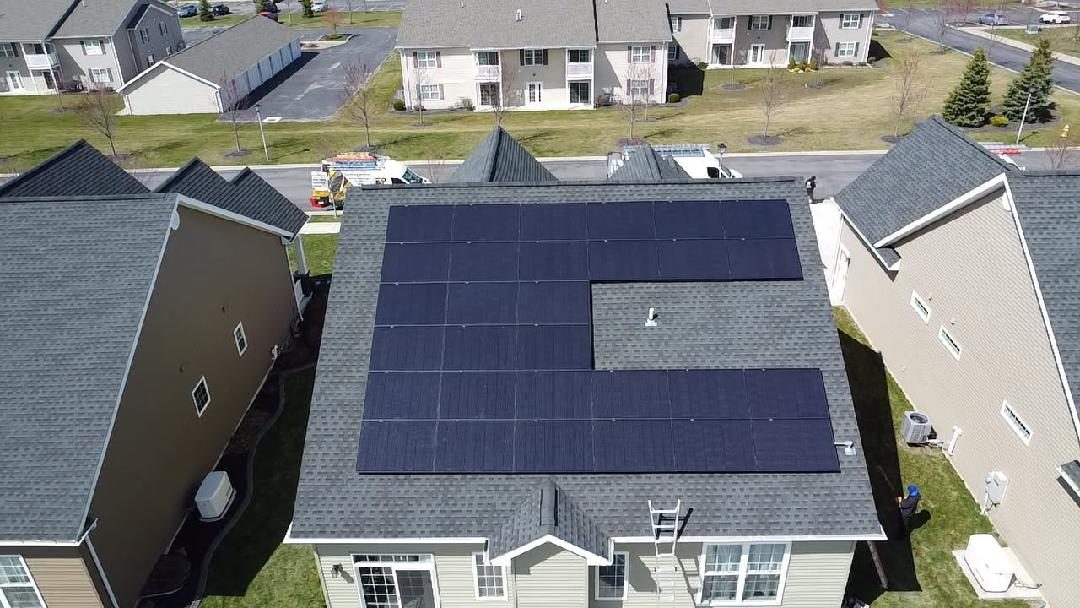 Aerial view of a roof covered in solar panels
